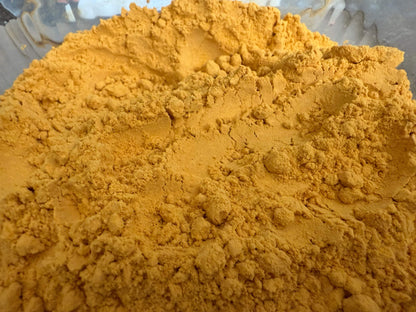 Close-up of yellow 7-oh powder on a clear background